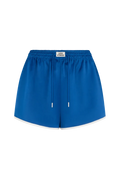 Blue shorts with a white label on a white background