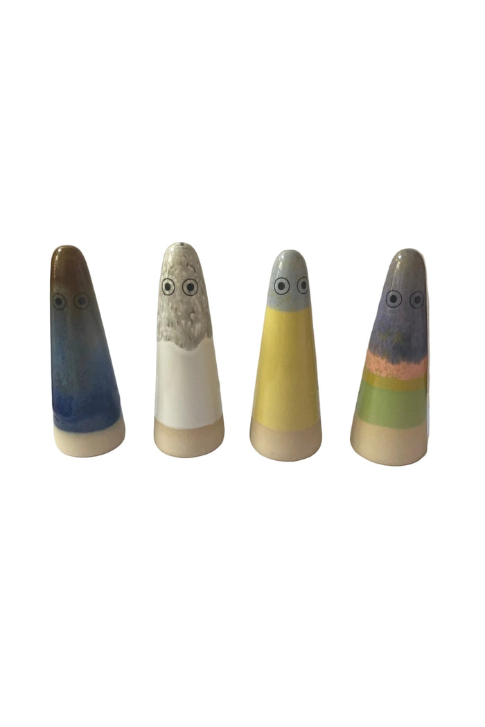 Four colorful ceramic figures with different color patterns on a white background