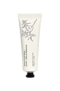 Hand cream tube with floral design on a white background