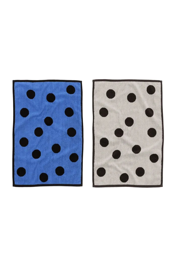 set of two hand towels with polka dot patterns on white background
