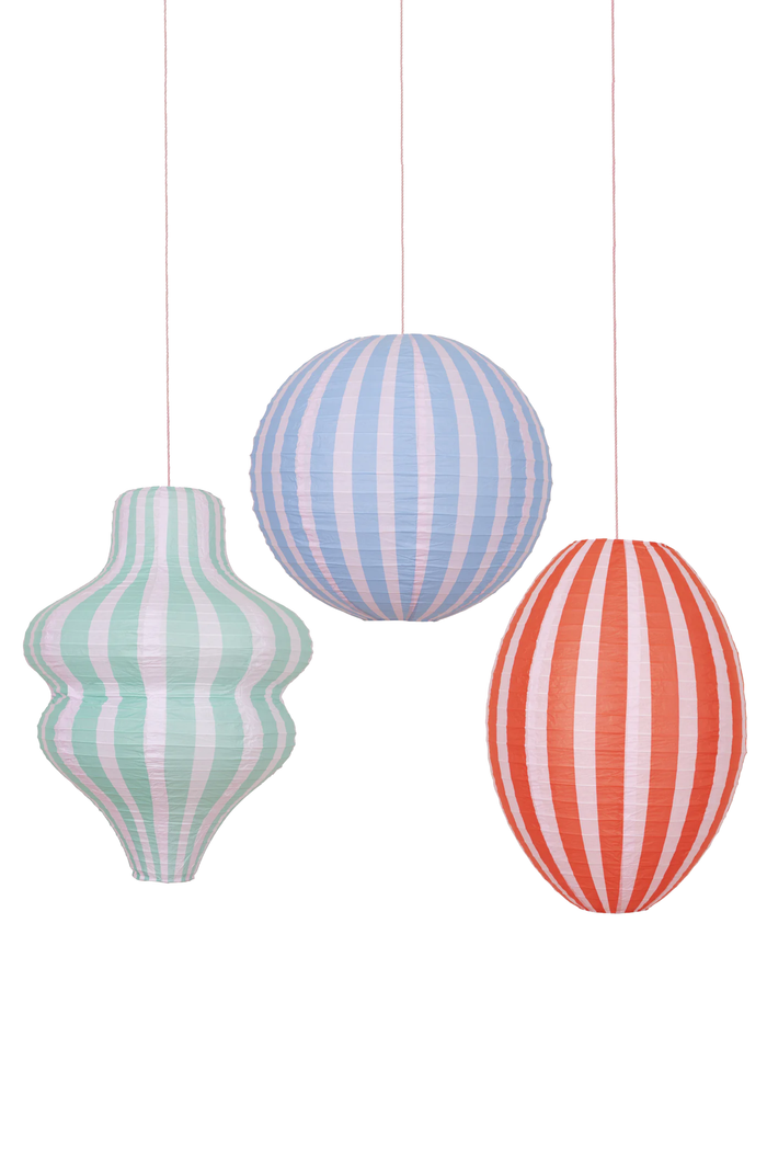 Three striped paper lanterns hanging against a white background
