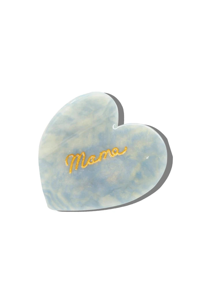 Heart-shaped acetate hair claw with 'Mama' engraving on a white background