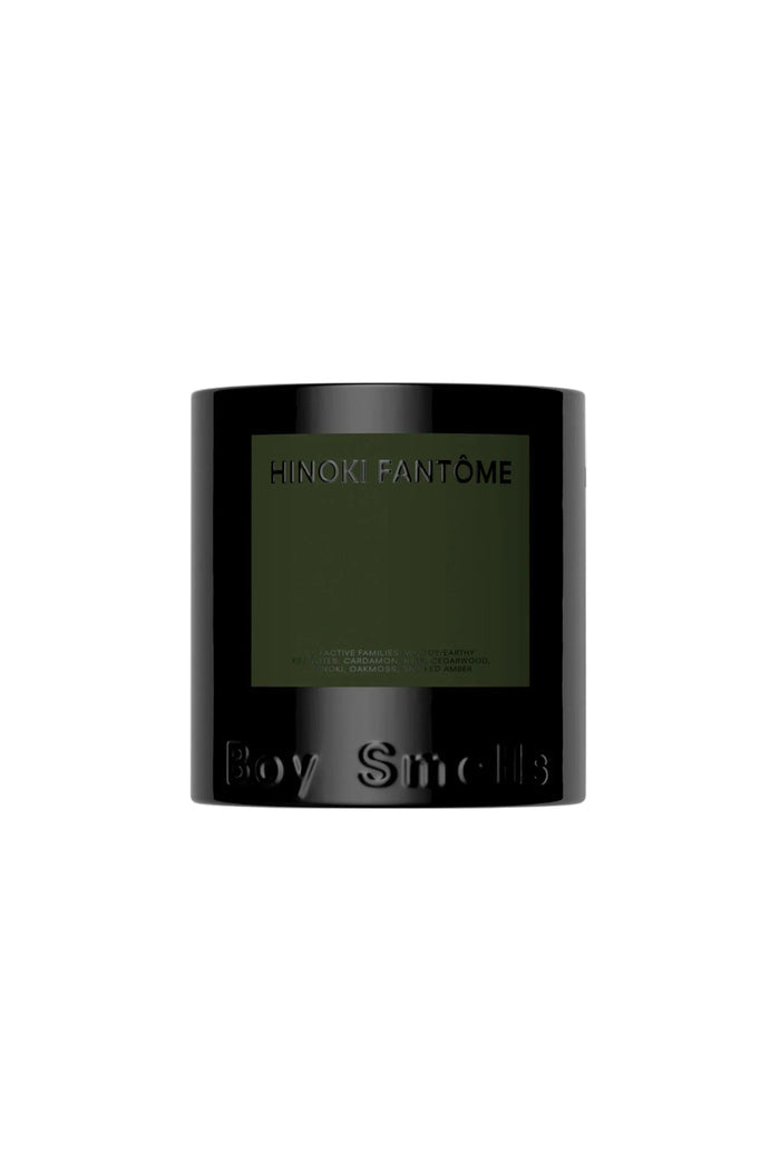 A black candle with a label that reads 'Hinoki Fantome' and 'Boy Smells' on the front.