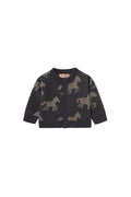 Dark baby cardigan with horse print on white background.