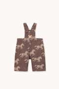 A pair of toddler boy's brown corduroy overall shorts with an allover horse print, shown flat on a light cream background.