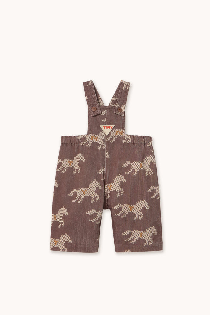 A pair of toddler boy's brown corduroy overall shorts with an allover horse print, shown flat on a light cream background.