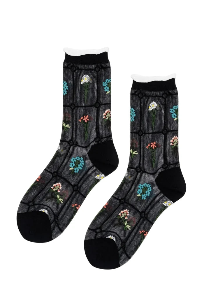 Pair of socks with floral patterns on a white background