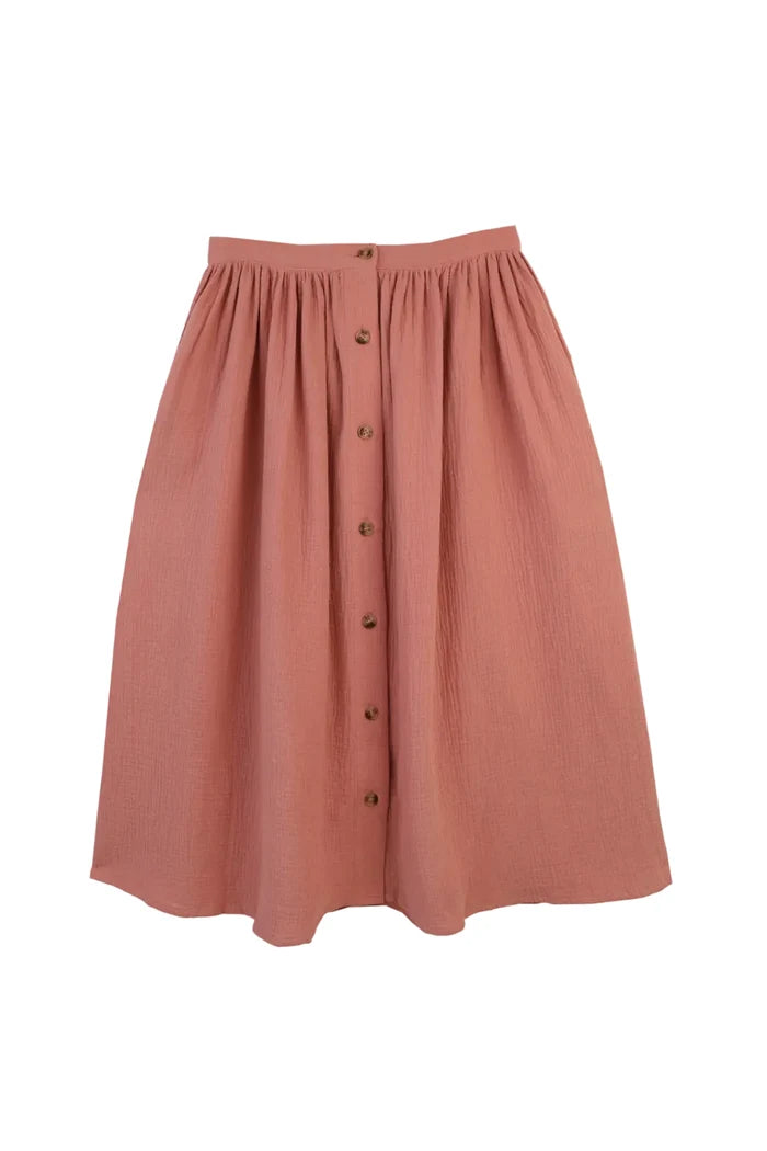 Pink skirt with button details on a white background