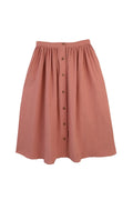 Pink skirt with button details on a white background