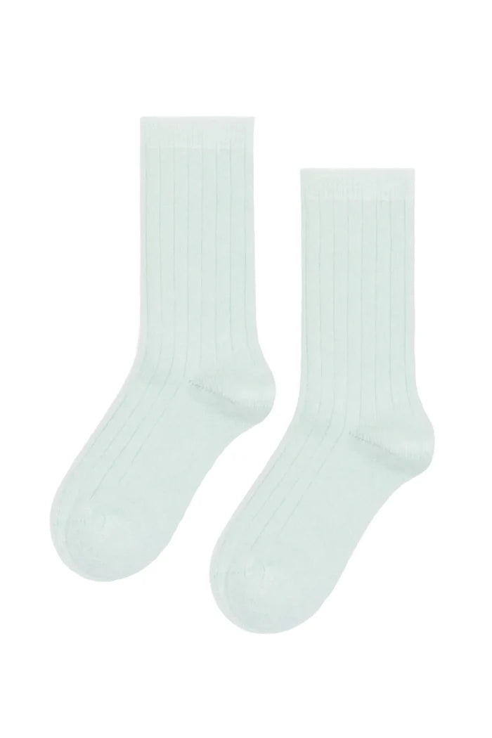 A pair of ribbed crew socks in a very pale mint green, shown flat against a plain white background.