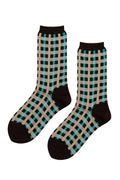 A pair of crew socks with a brown, beige, and teal checkered pattern, displayed against a plain white background.