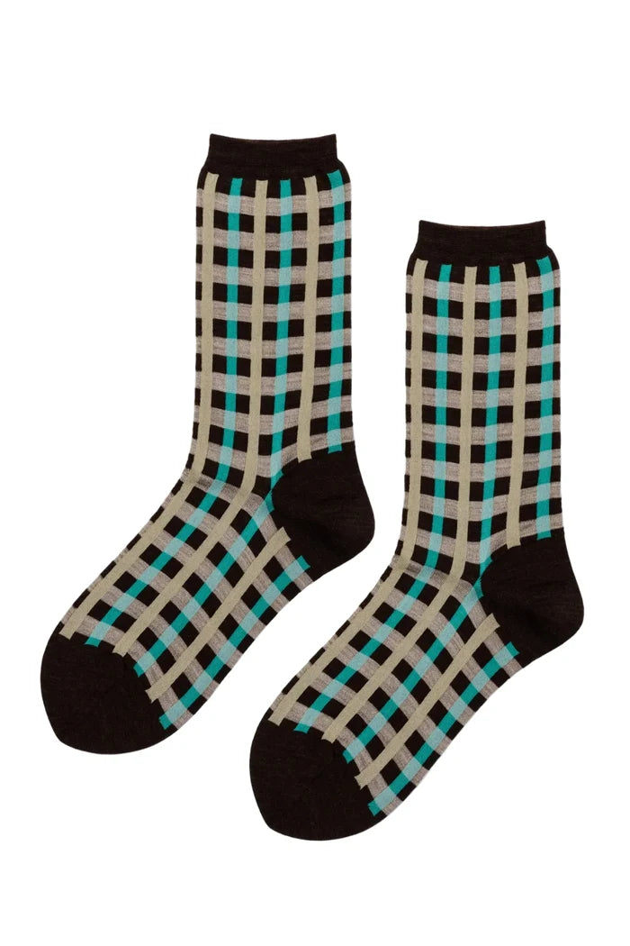 A pair of crew socks with a brown, beige, and teal checkered pattern, displayed against a plain white background.