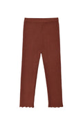 A pair of solid rust-brown cropped leggings with scalloped edges at the bottom, displayed flat against a light gray background.