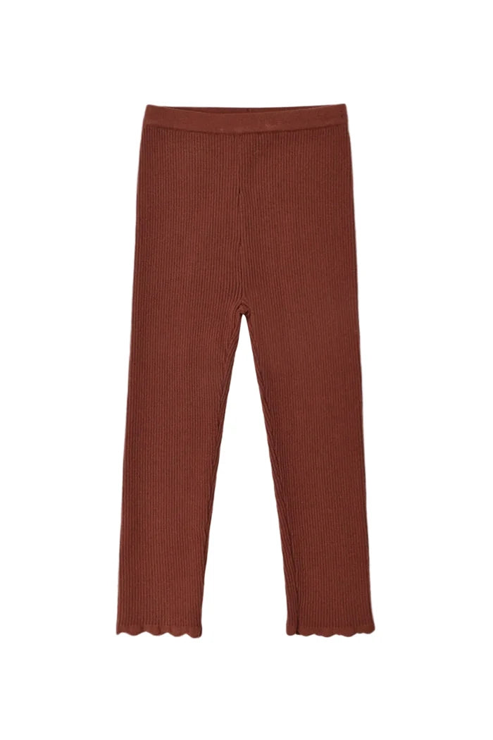 A pair of solid rust-brown cropped leggings with scalloped edges at the bottom, displayed flat against a light gray background.