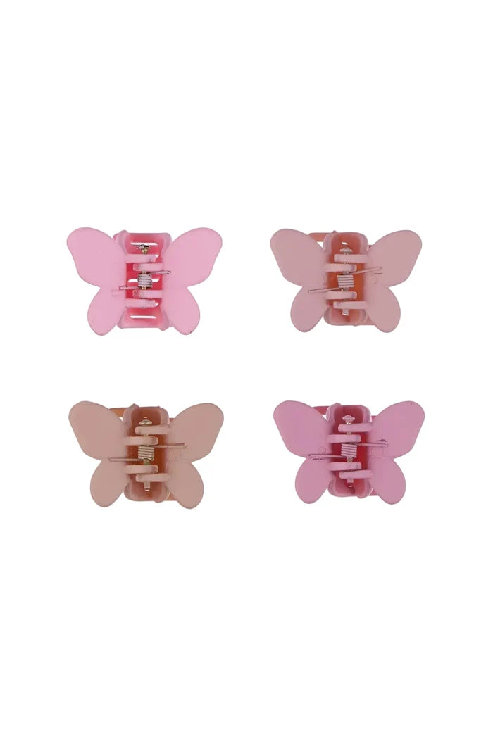 Four pink butterfly-shaped hair clips on a white background