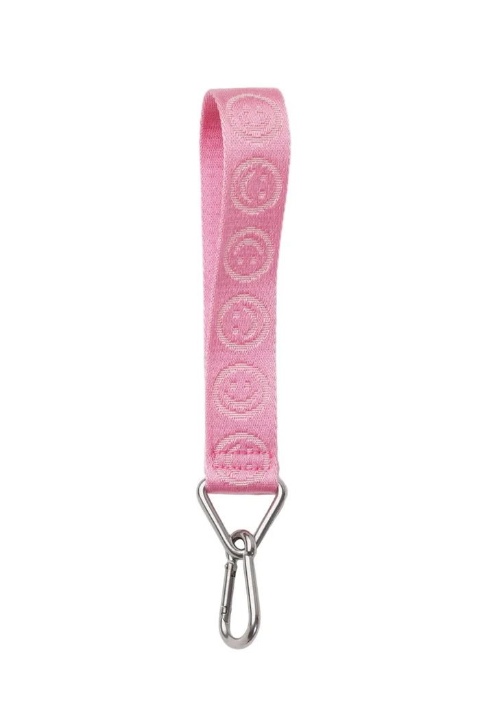 Pink strap with embroidered design and metal clip on a white background