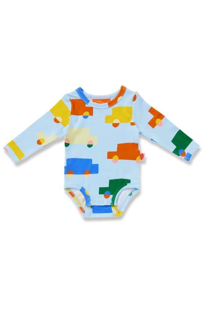A baby long-sleeve bodysuit in light blue with a colorful pattern of cartoon cars in yellow, orange, green, and blue, shown on a plain white background.