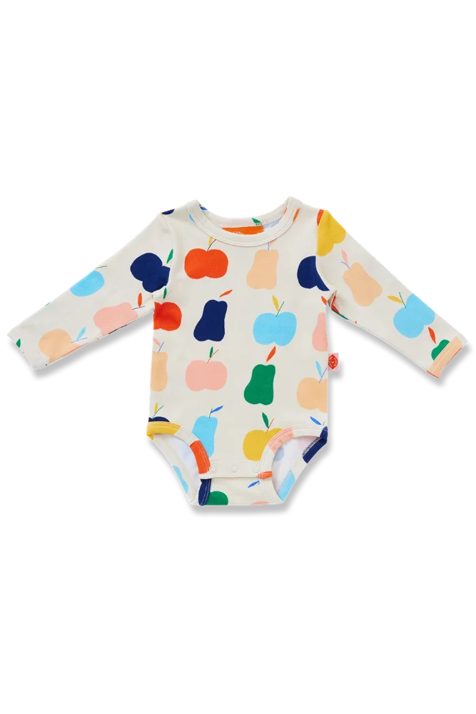 A baby long-sleeve bodysuit with an off-white background and a colorful fruit print featuring apples and pears in orange, blue, yellow, green, and pink. A small red tag is visible on the right side of the chest.