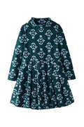 Green dress with floral pattern on a white background