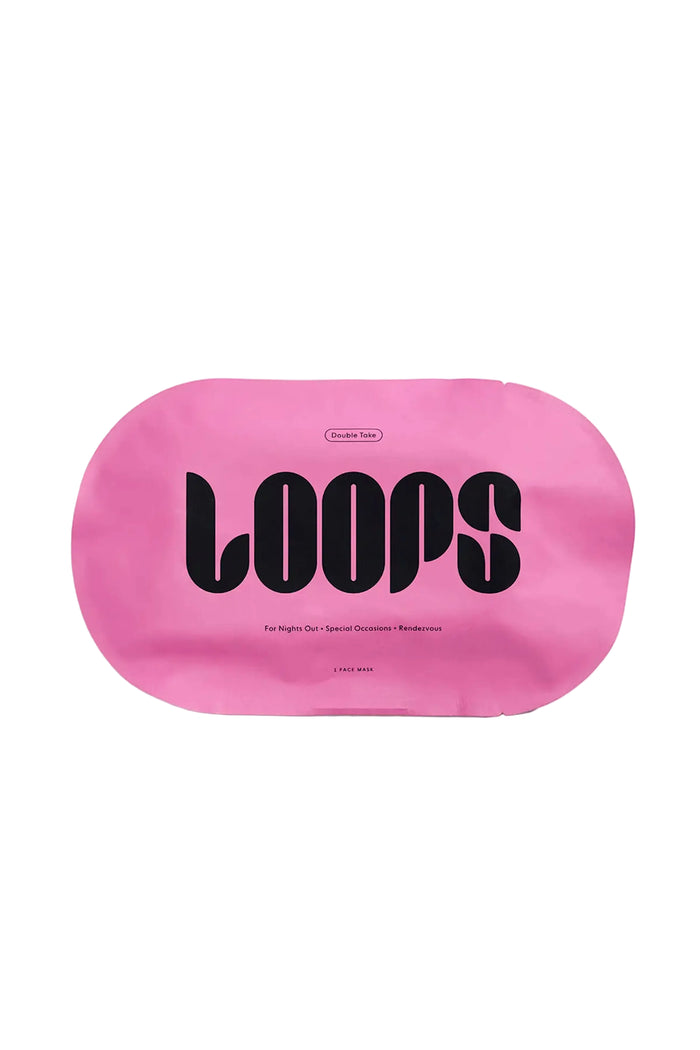 A pink single-use face mask packaging with the brand name 'Loops' written in black text.