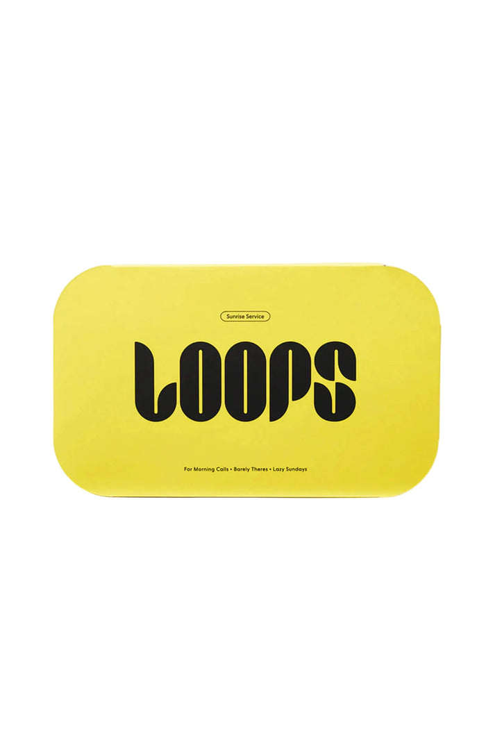 A yellow package with the brand name 'Loops' written in black text, indicating it is a beauty product.