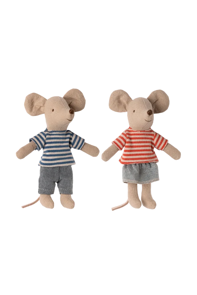 Two toy mice dressed in striped shirts and shorts on a white background