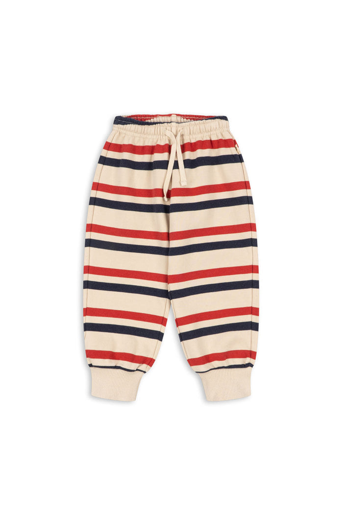 A pair of children's striped jogger pants with horizontal navy, red, and cream stripes, featuring an elastic waistband with a drawstring and ribbed cuffs.