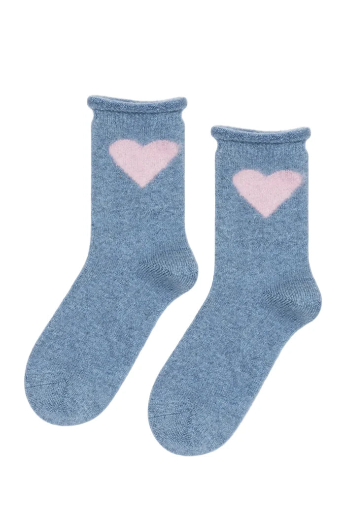 Pair of blue socks with pink heart designs on a white background