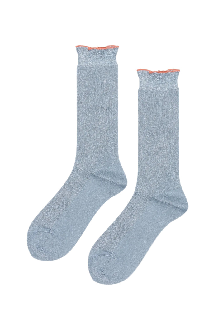 A pair of light blue crew socks with a subtle shimmer texture and a contrasting orange lettuce hem, displayed against a plain white background.