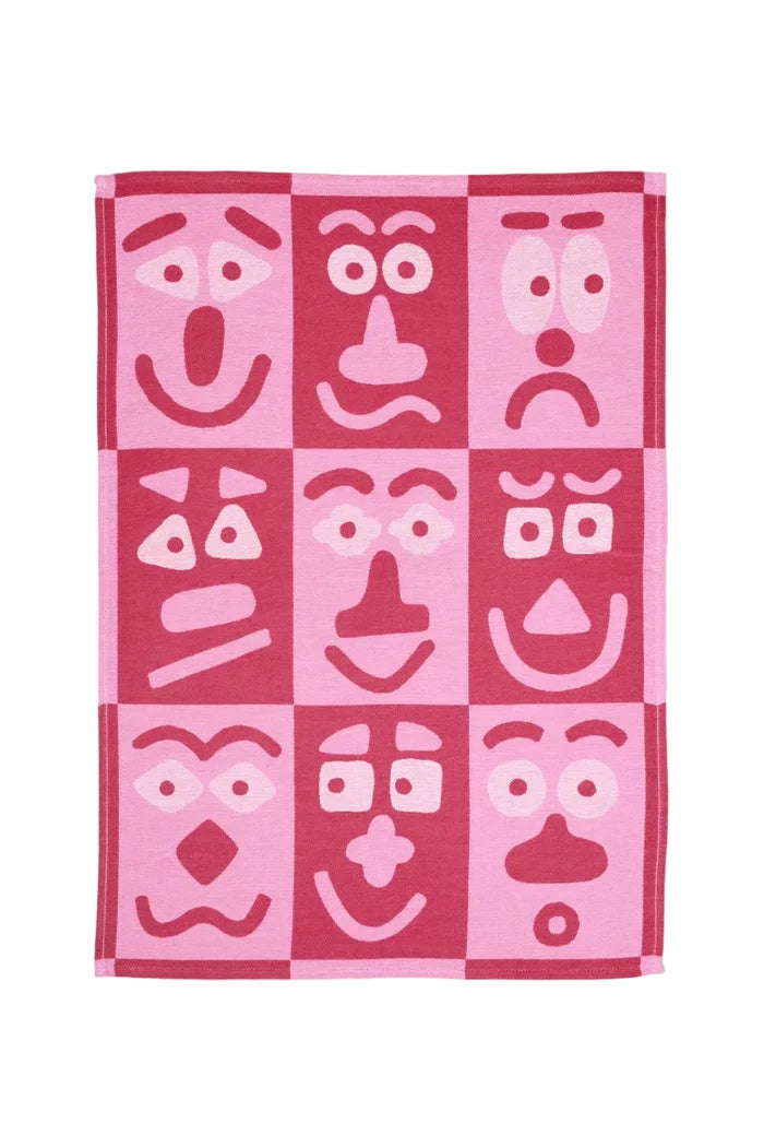 Tea Towel with checker pattern and cartoon faces on white background