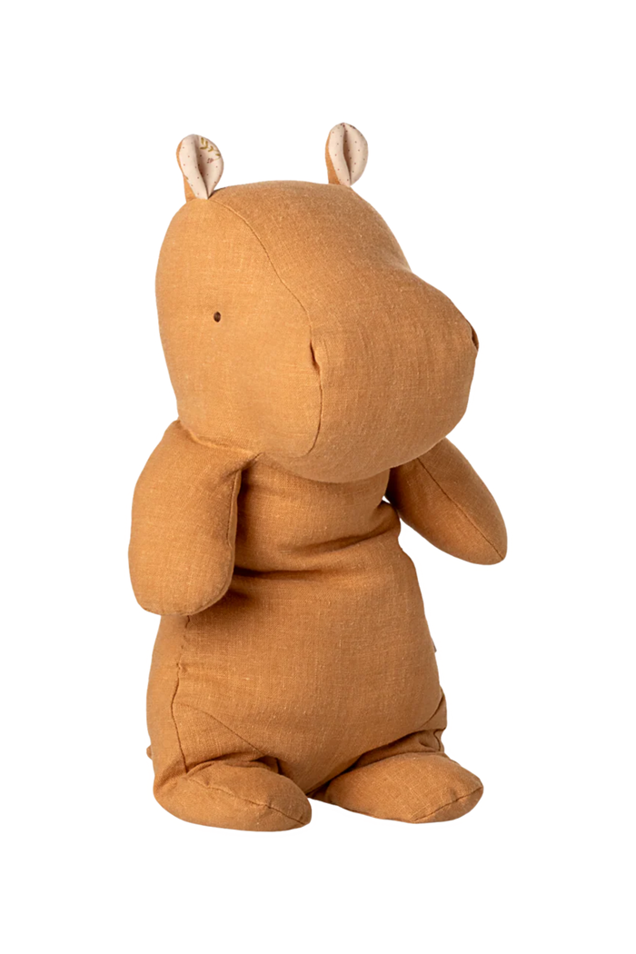 Yellow stuffed hippo on white background