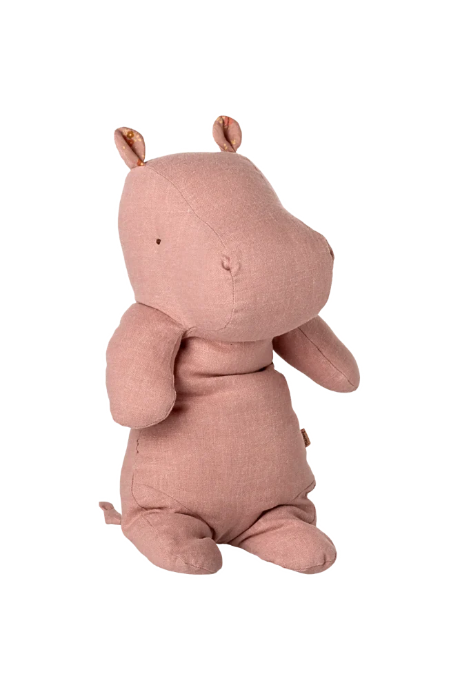 Pink hippo plush toy on a white background