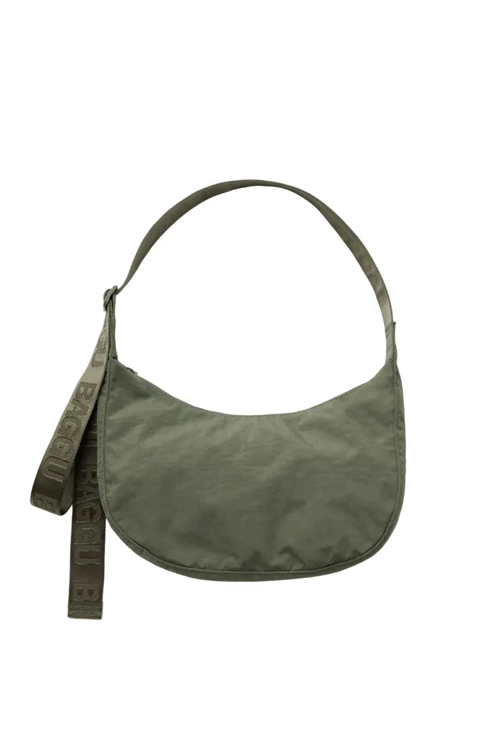 Green cross body bag on white background