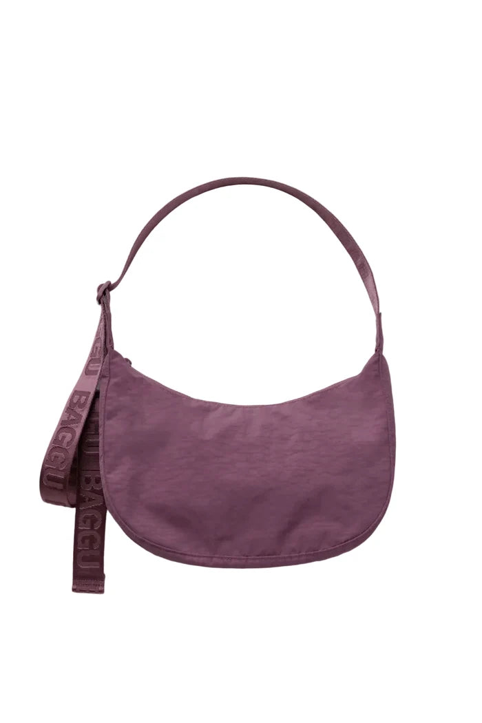 Purple crossbody bag on white background