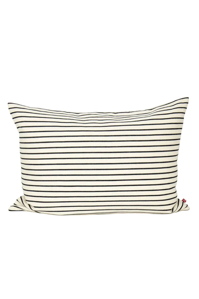 Striped pillow with black and white lines on a white background