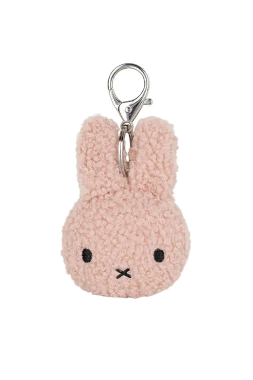 A light pink plush bunny keychain with embroidered black eyes and mouth, attached to a silver metal lobster clasp, shown on a plain white background.