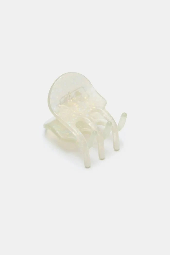 Clear iridescent hair claw clip on light grey background