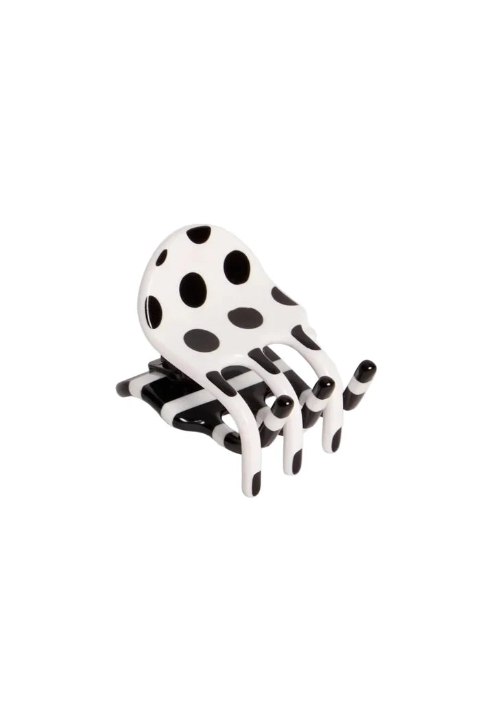 Black and white patterned hair claw clip on light grey background
