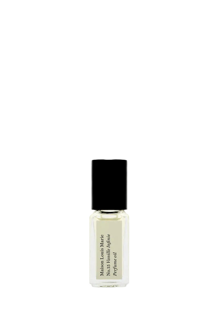 Small perfume bottle with black cap on a white background