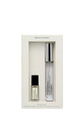 Two small bottles in a white box on a light gray background