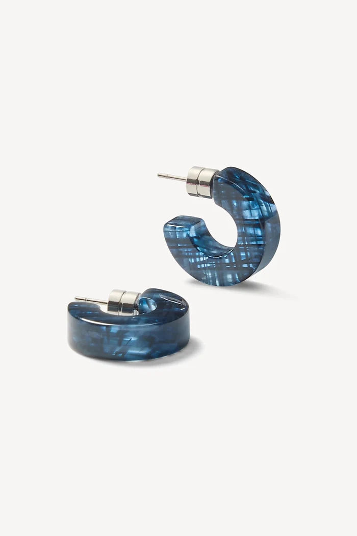 Pair of blue hoop earrings on a white background