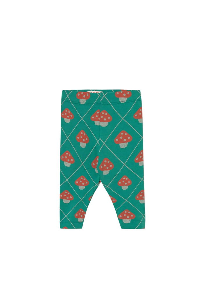 A pair of toddler leggings with a green background, featuring a repeating pattern of red and white mushrooms and thin white diagonal lines.