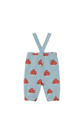 Light blue baby pants with red and white mushroom print and adjustable suspenders, shown flat on a cream background.