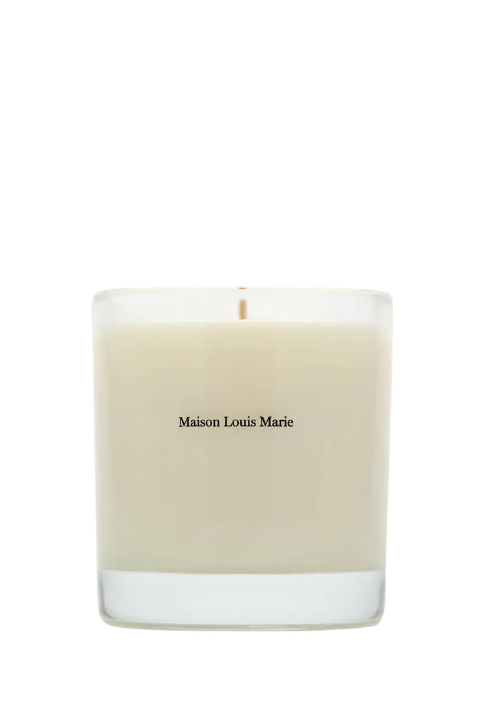 Beige candle with 'Maison Louis Marie' branding on a white background