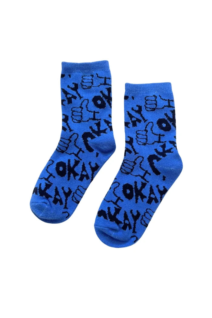 Blue baby socks with graphic "okay" pattern on white background