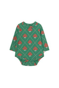A long-sleeve baby bodysuit with a green base featuring a repeating pattern of red and white mushrooms inside a diamond grid, shown on a plain off-white background.