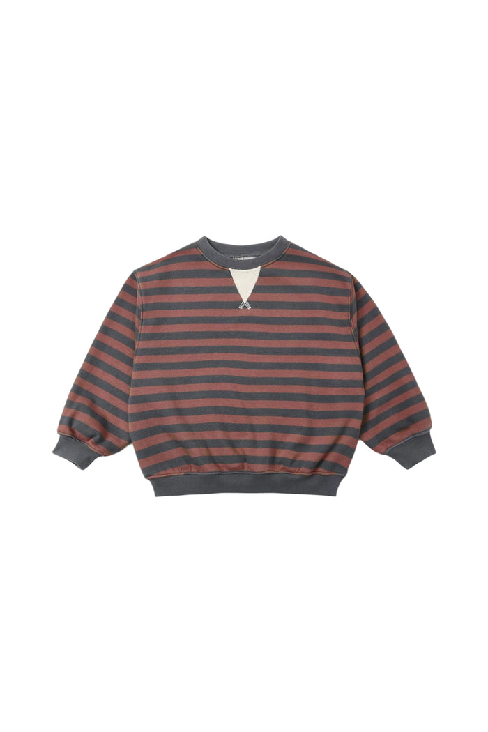 A long-sleeve crewneck sweatshirt with horizontal brown and dark gray stripes, featuring a small white geometric detail at the center of the chest and ribbed cuffs and hem.