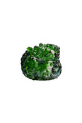 A sculptural green glass object with a bubbly, organic texture, isolated on a solid white background.