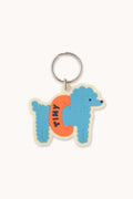 Keychain with a blue dog wearing an inflatable tube on a white background