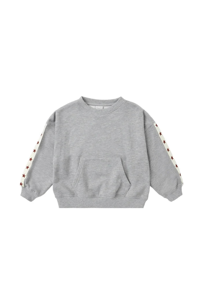 A light gray heather crewneck sweatshirt with a front kangaroo pocket and decorative star-patterned stripes running down the sleeves, shown flat on a light gray background.